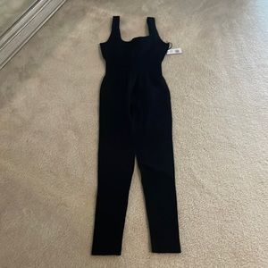 WeWoreWhat black ribbed athleisure jumpsuit